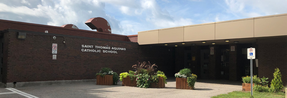 exterior front entrance of school with flower boxes