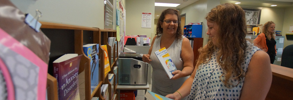 Two parent volunteers talking.