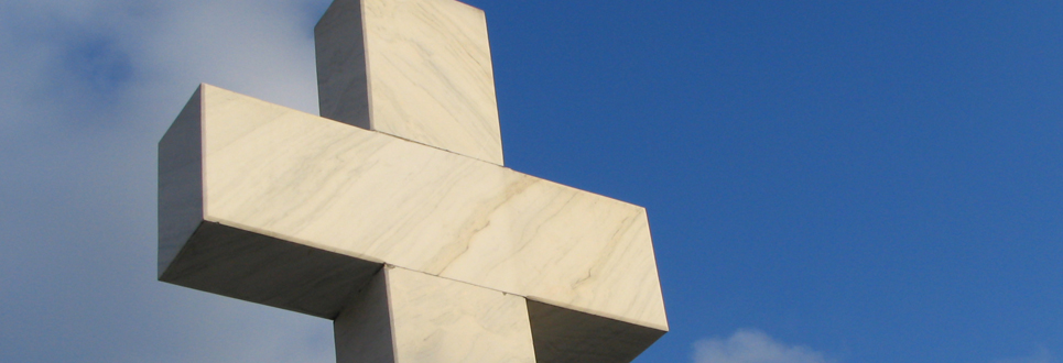 A large cross monument outside.